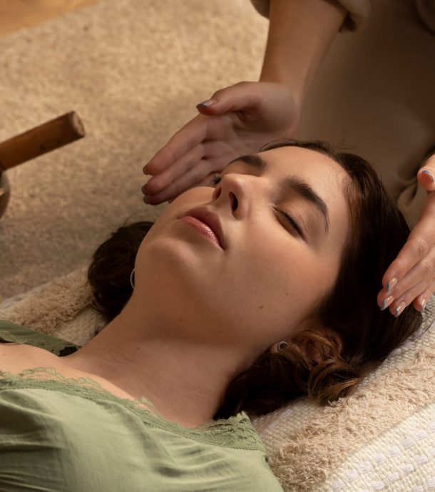 person-conducting-reiki-therapy