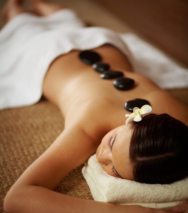 Portrait of young female having beauty procedure in spa salon
